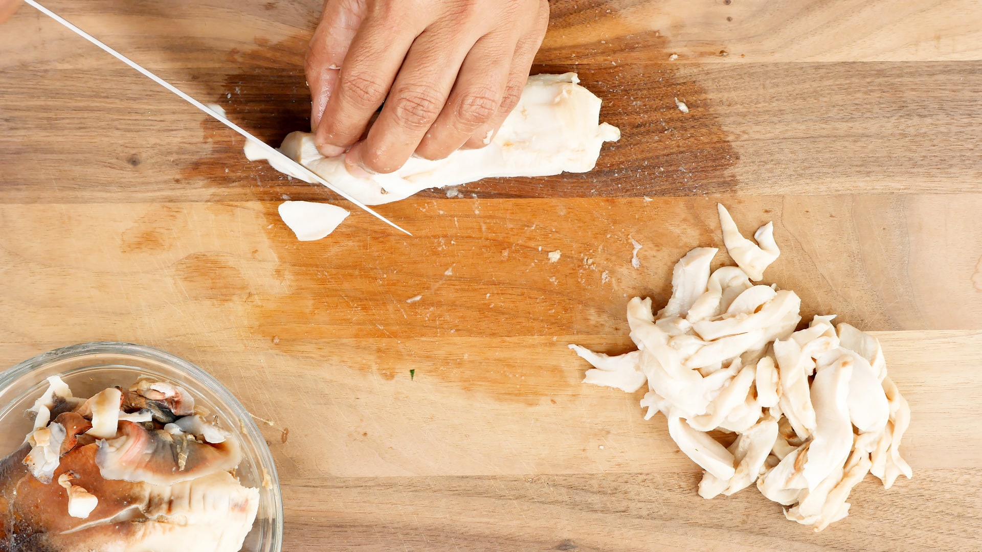 Cleaning and cutting lambi (conch)