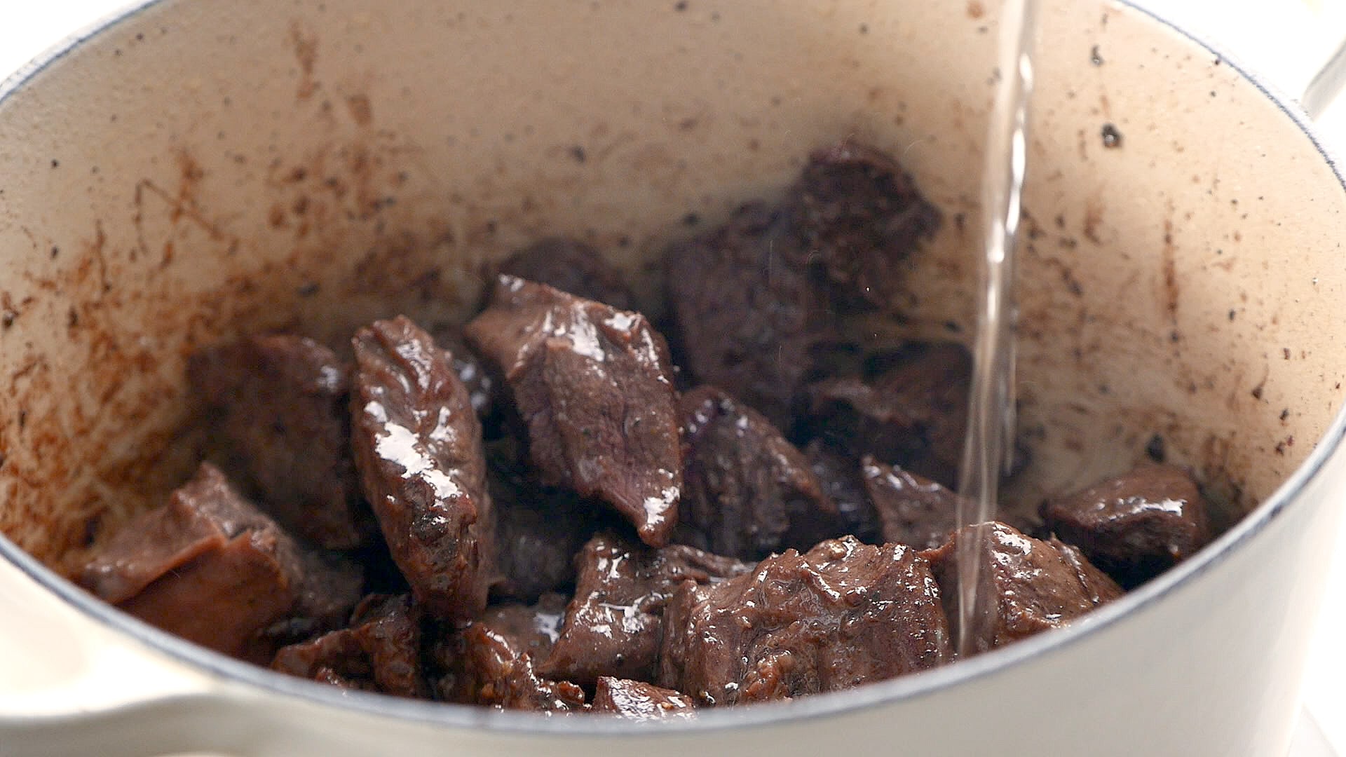 Adding water to browned meat