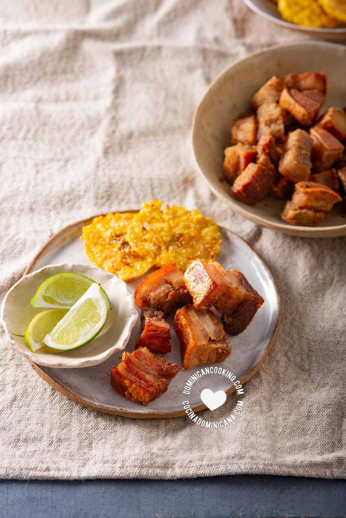 Air fryer chicharrones with tostones and lemon wedges