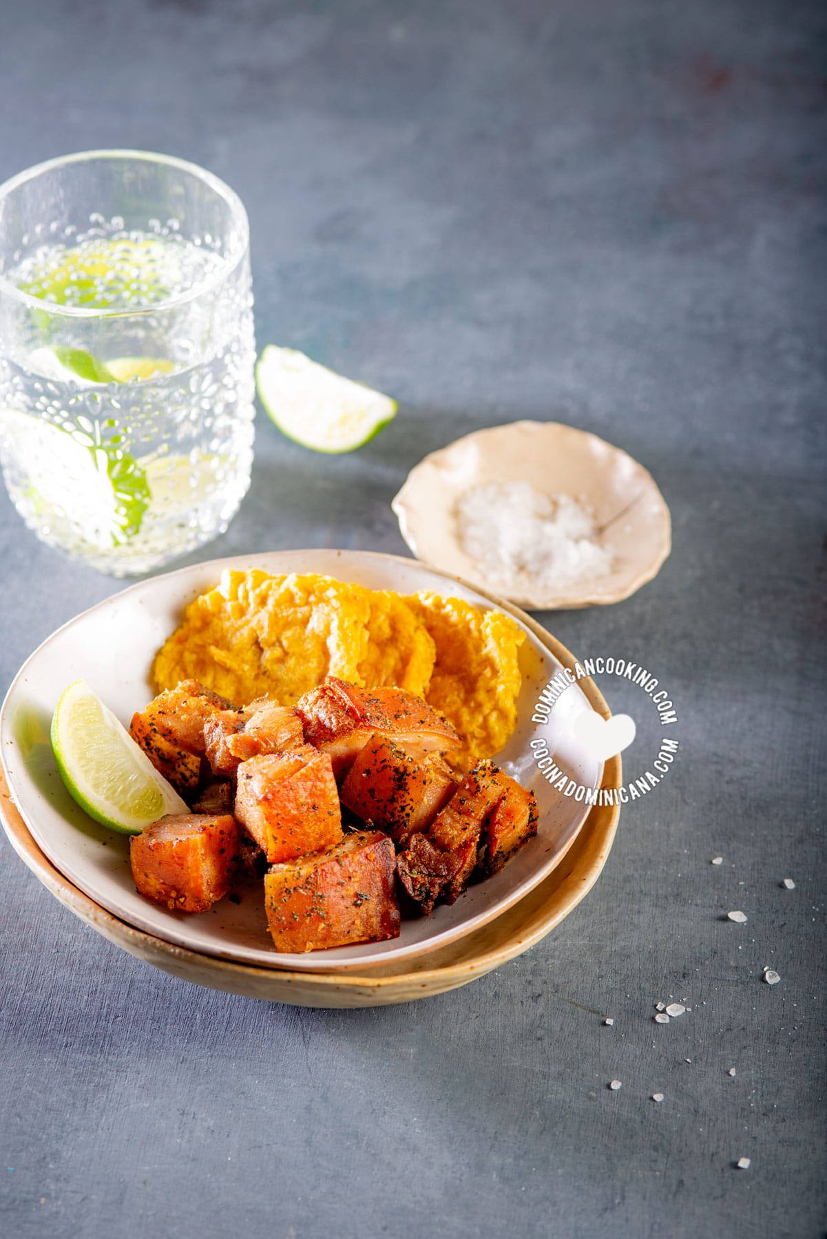 Air fryer chicharrones with tostones and lemon wedges