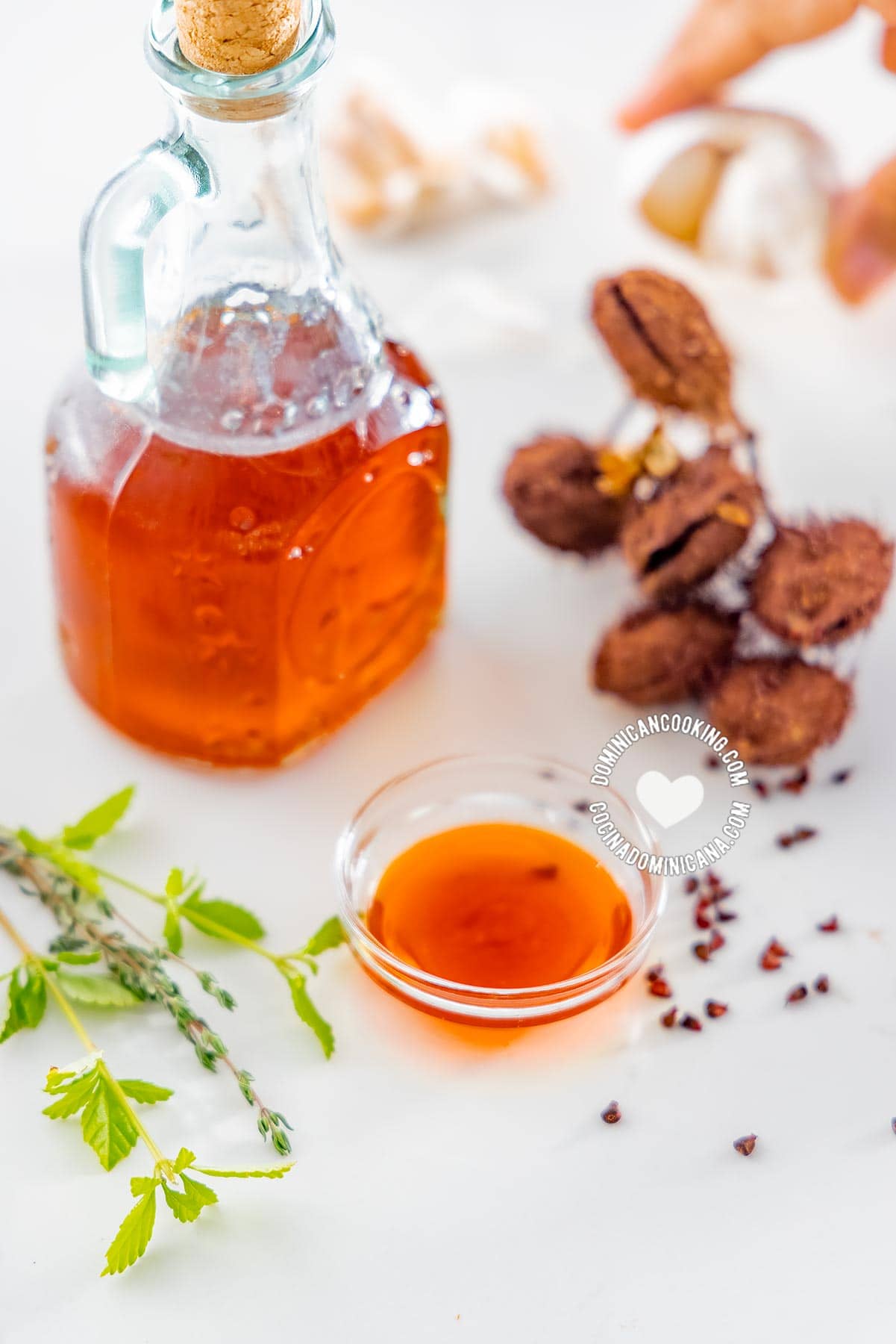 Bottle and bowl of aceite de bija (annato oil)