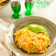 Arroz Amarillo Served with Avocado (Carrot and Onions Yellow Rice)