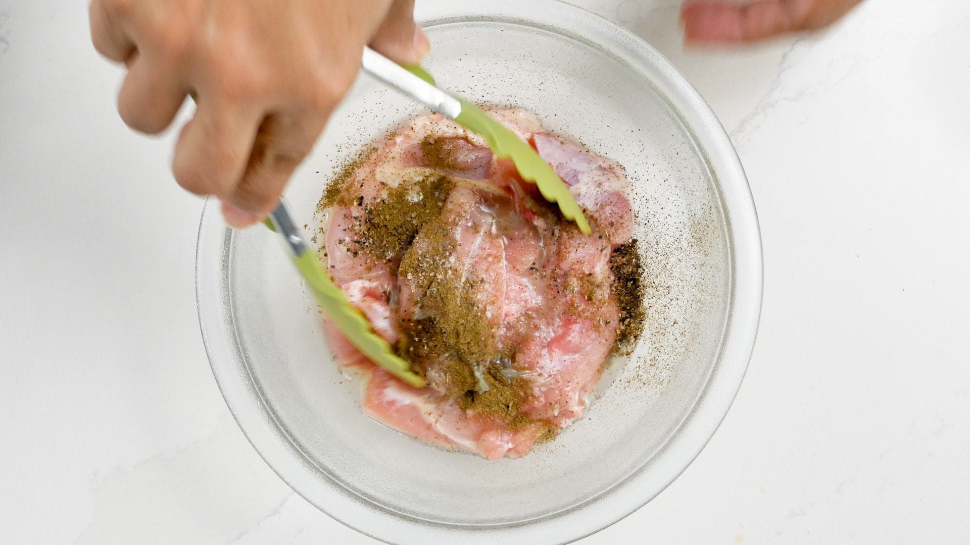 Seasoning the chicken