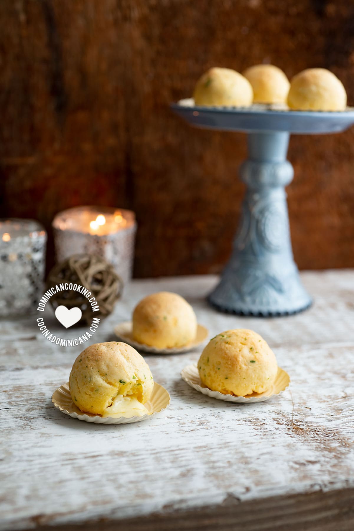 Baked Cheese-Stuffed Yuca Balls served on tiny paper plates