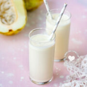 2 glasses of batida de granadillo (granadilla milkshake) and fruits