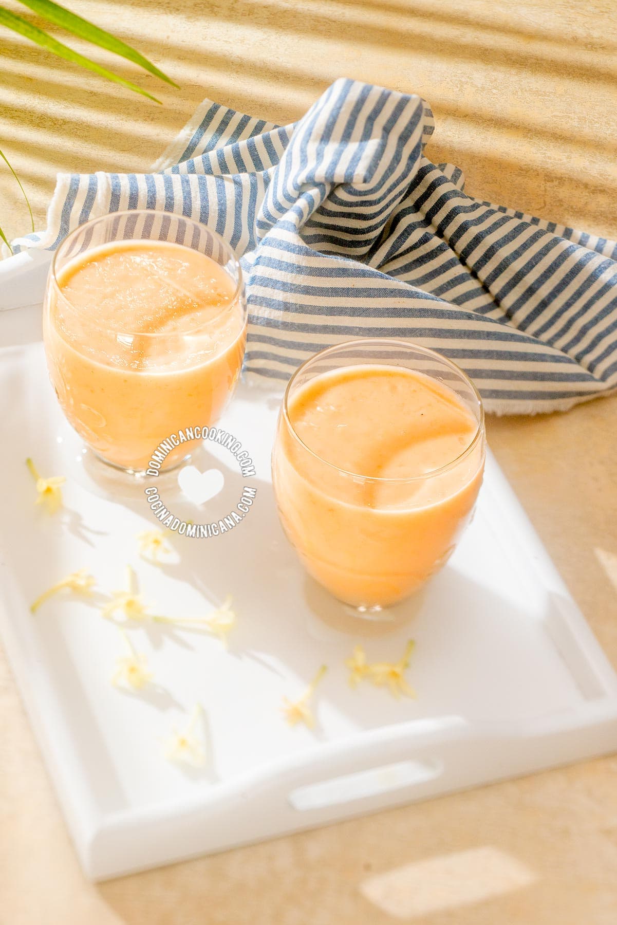 2 glasses of Batida de Lechosa (Papaya Milkshake) and Papaya Flowers