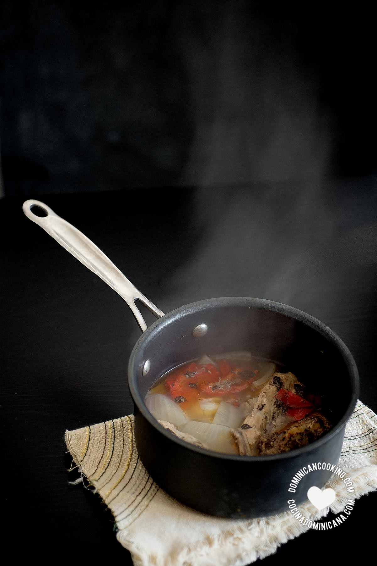 Steamy pot of ingredients for broth