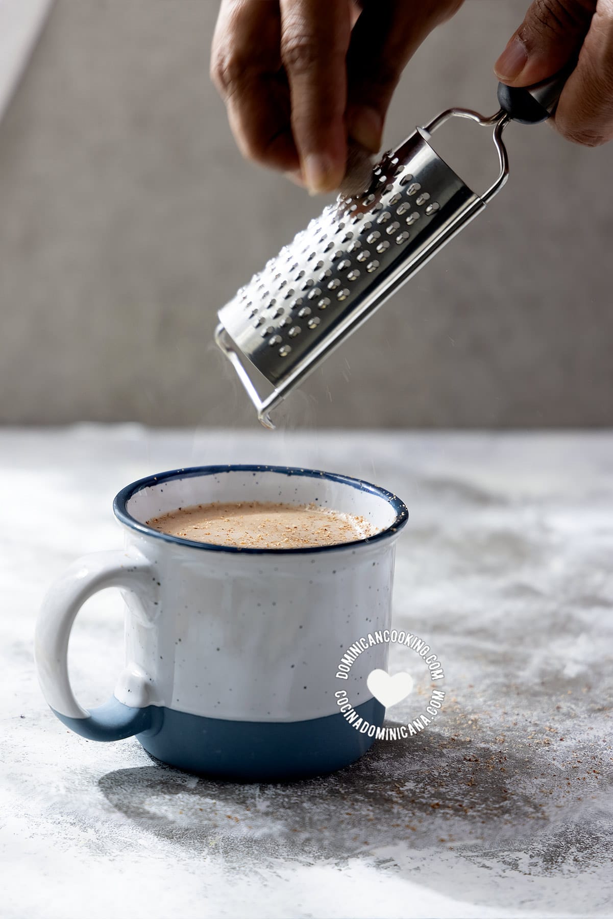 Grating nutmet into peanut 'cocoa'