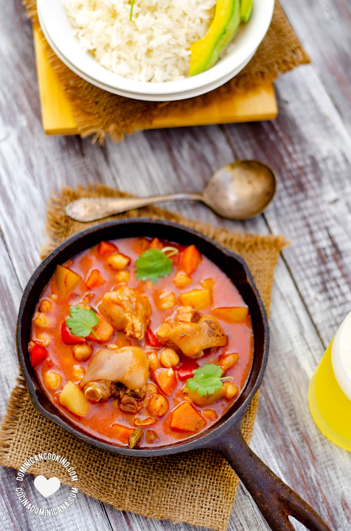 Cocido de Paticas (Pig Trotters Stew) Served with Rice and Avocado