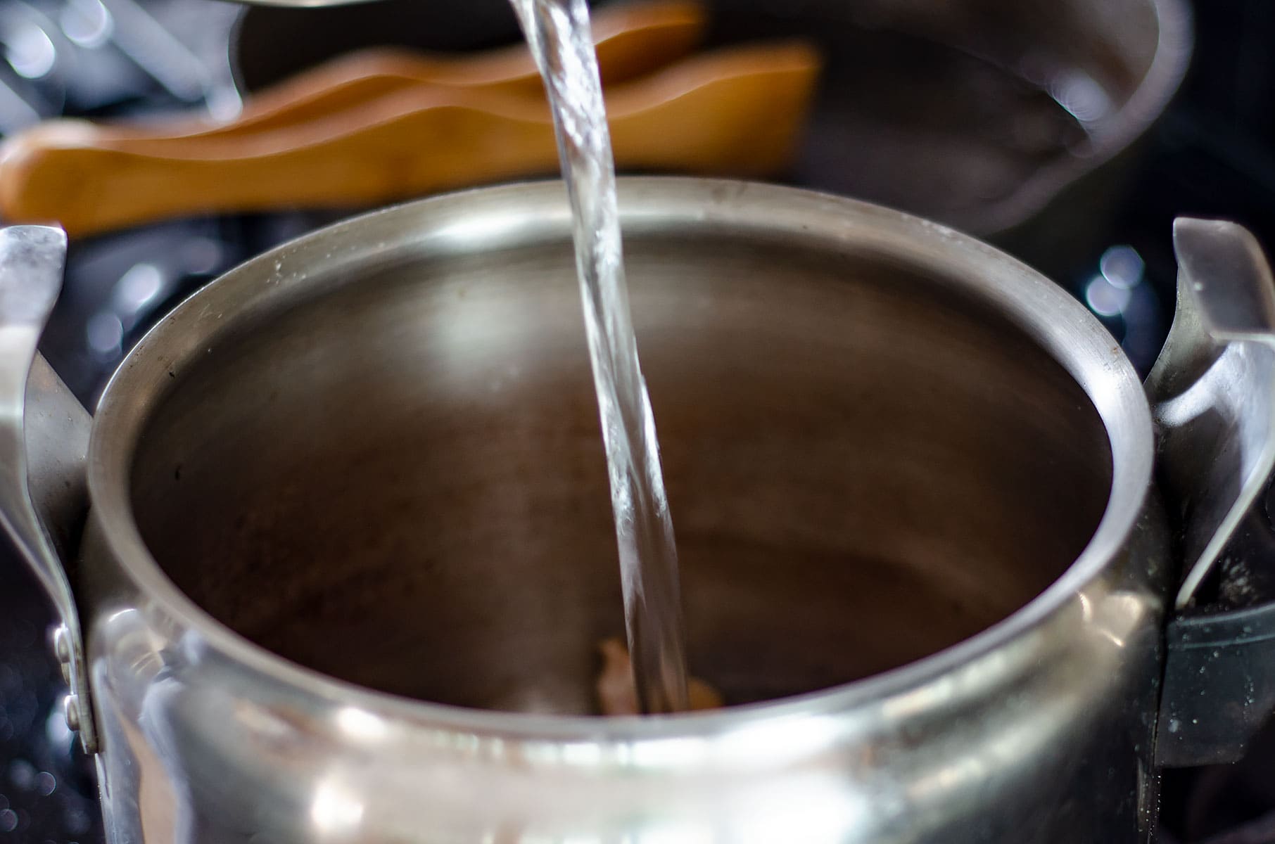 Adding water to the pot