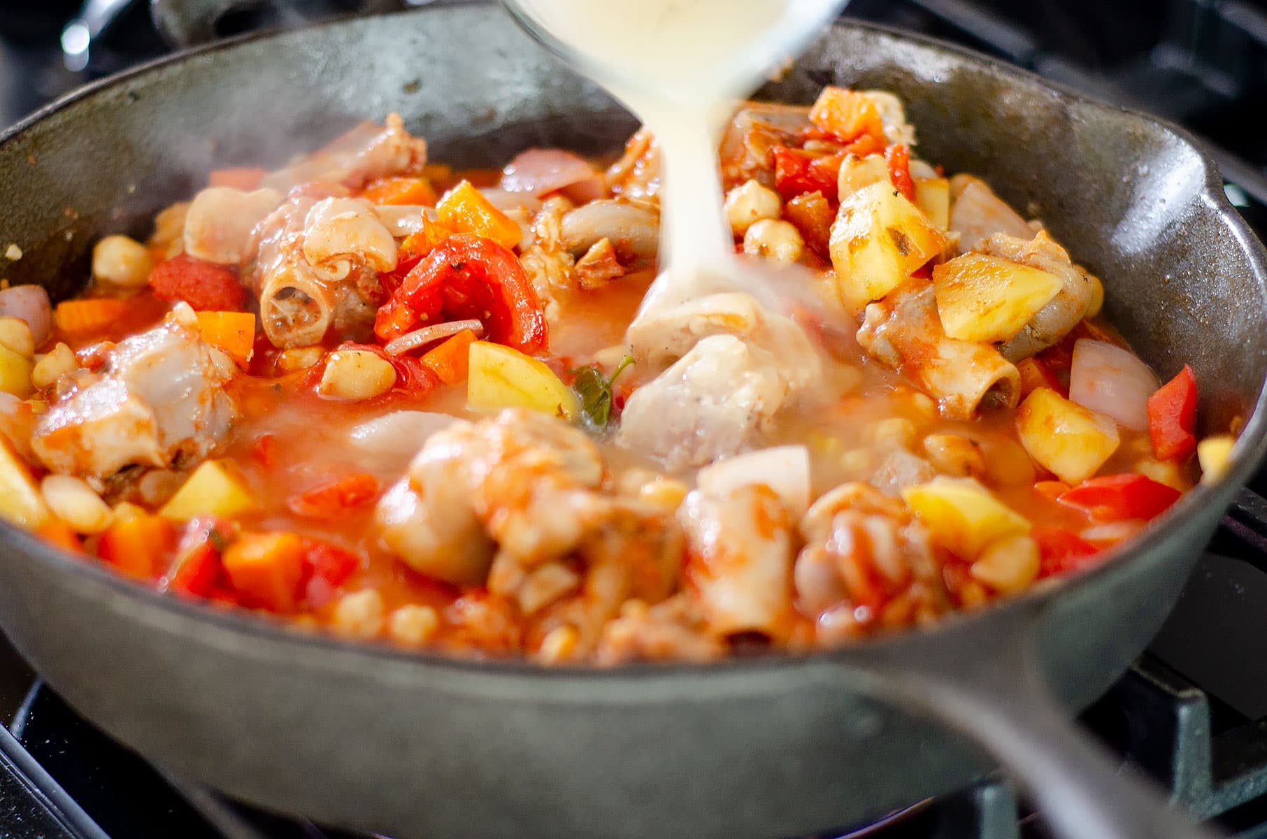 Adding liquid to the pot