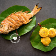Fried fish (pescado frito) on leaves with fried plantains