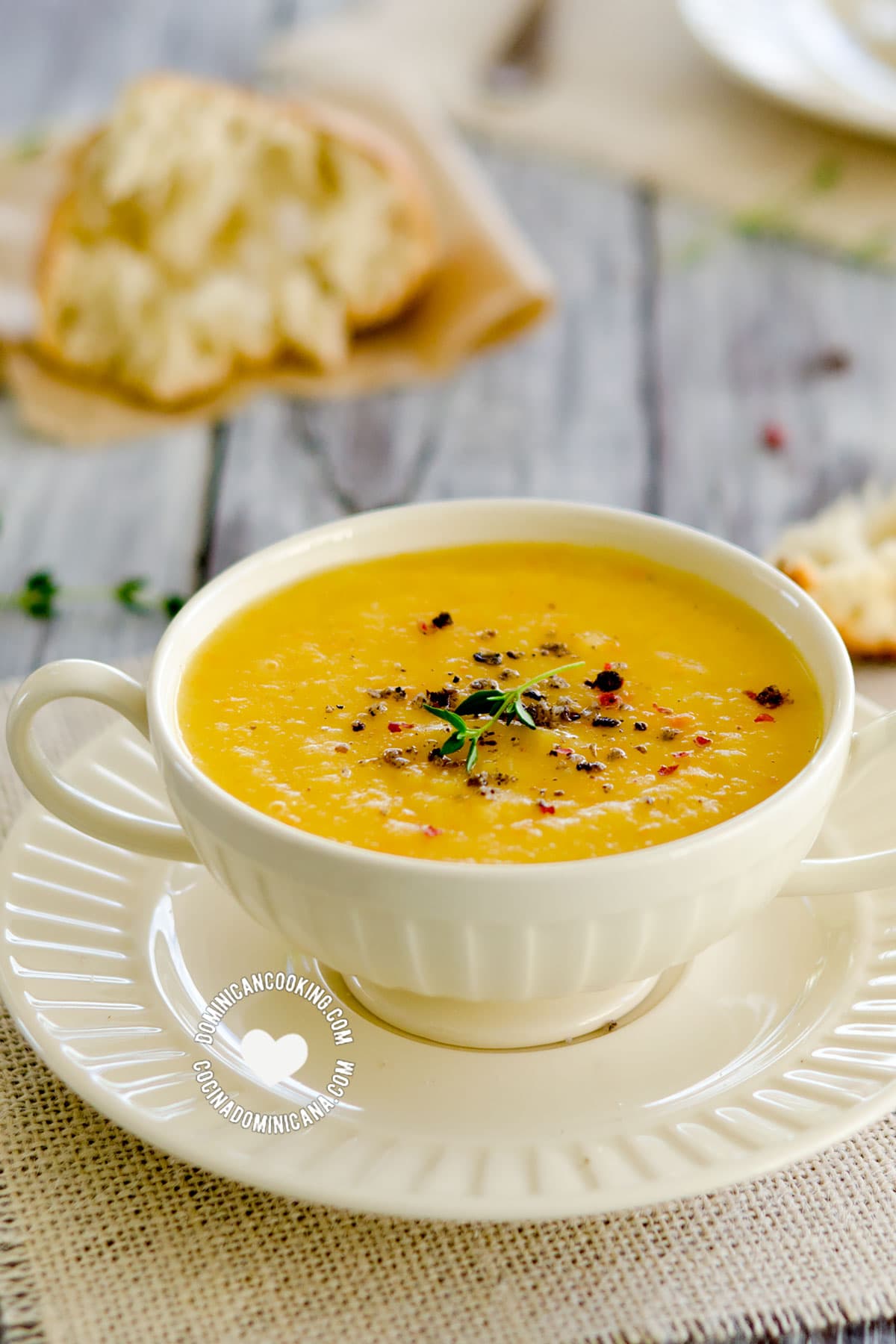 Bowl of Cream of Arracacha and Ginger Soup (Cepa de Apio) served with Bread