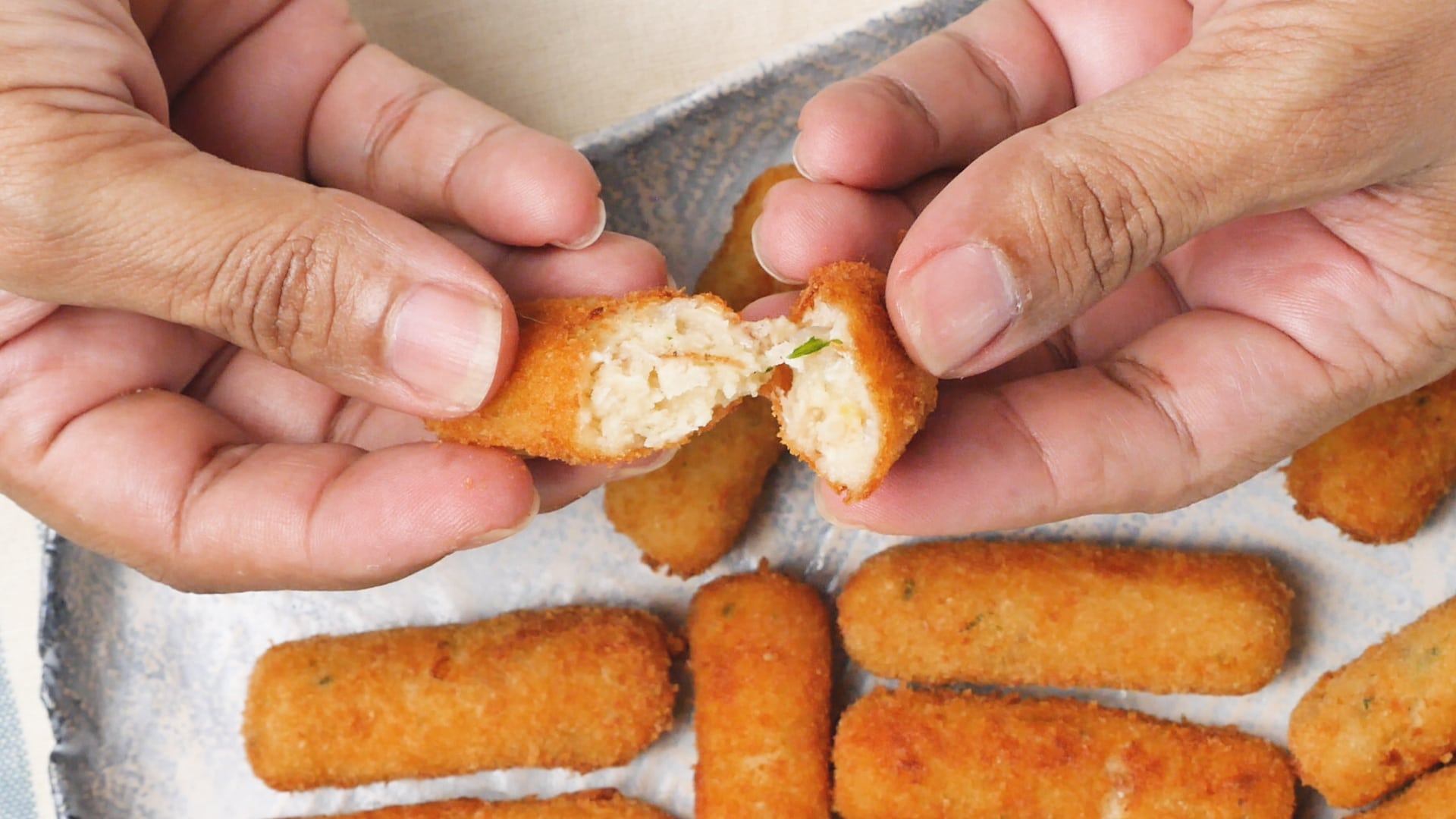 Breaking a croquette to show the inside