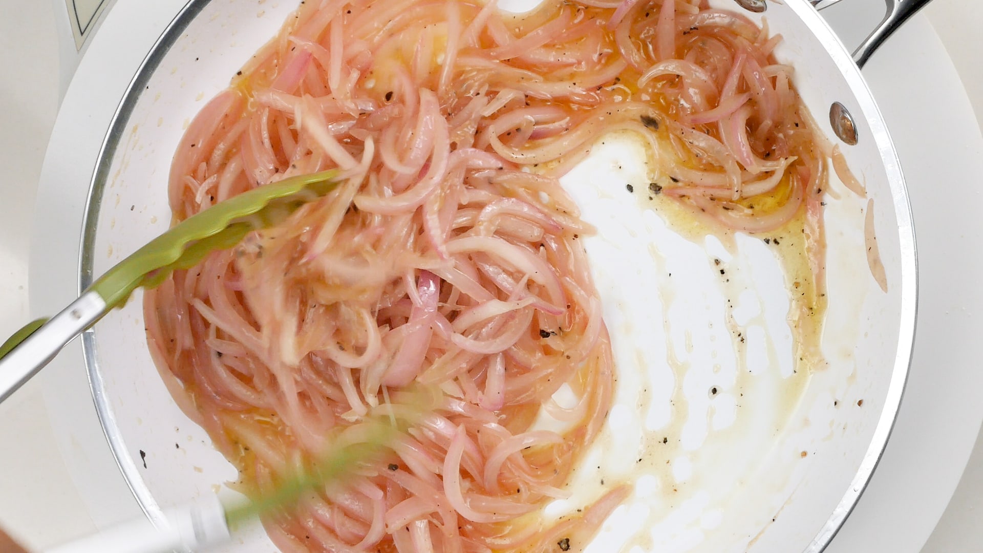 Stirring onions with vinegar