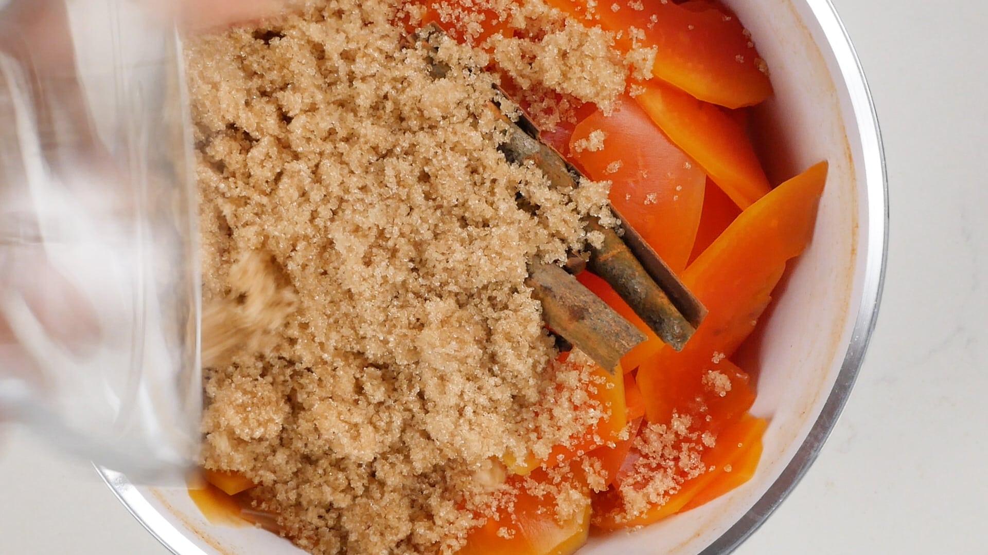 Adding sugar to papaya