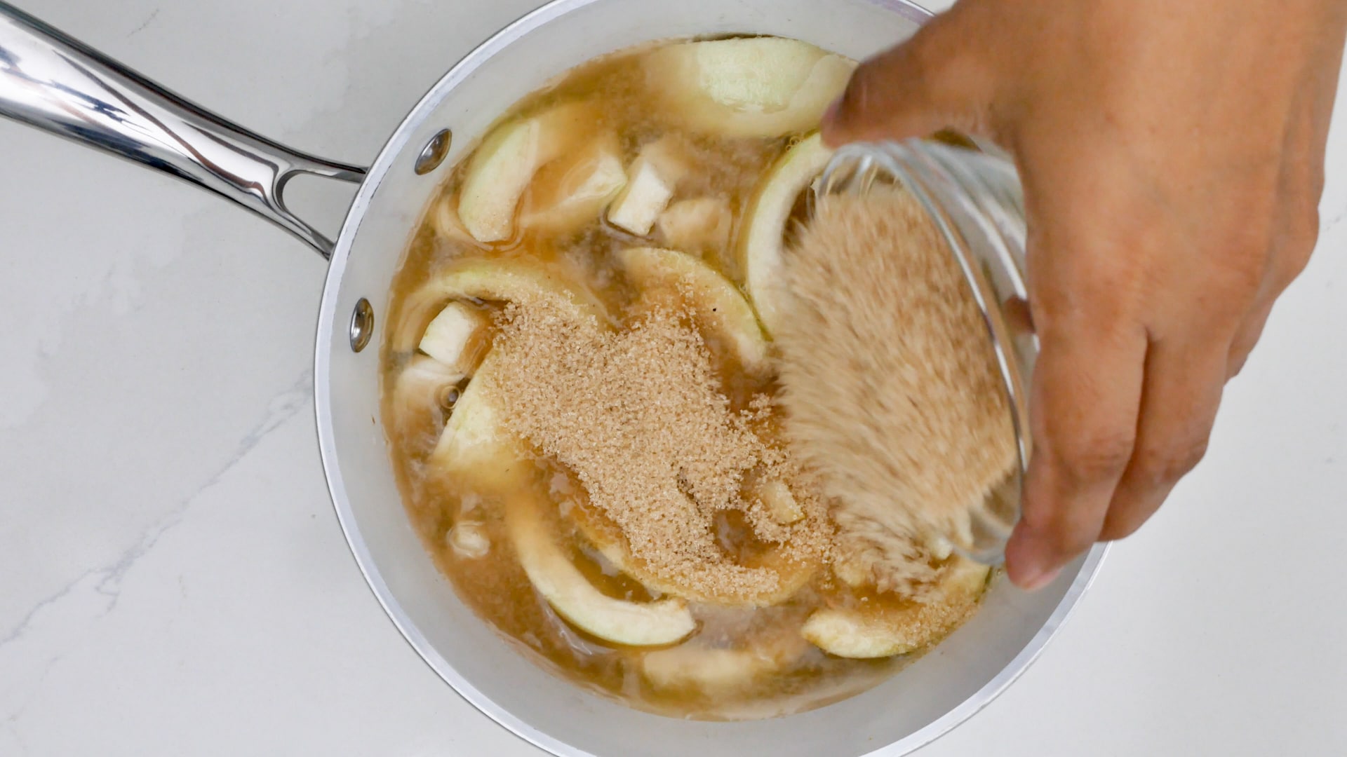 Adding sugar to the guava