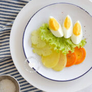 Ensalada Hervida (Boiled Salad) served alongside vinaigrette seen from above