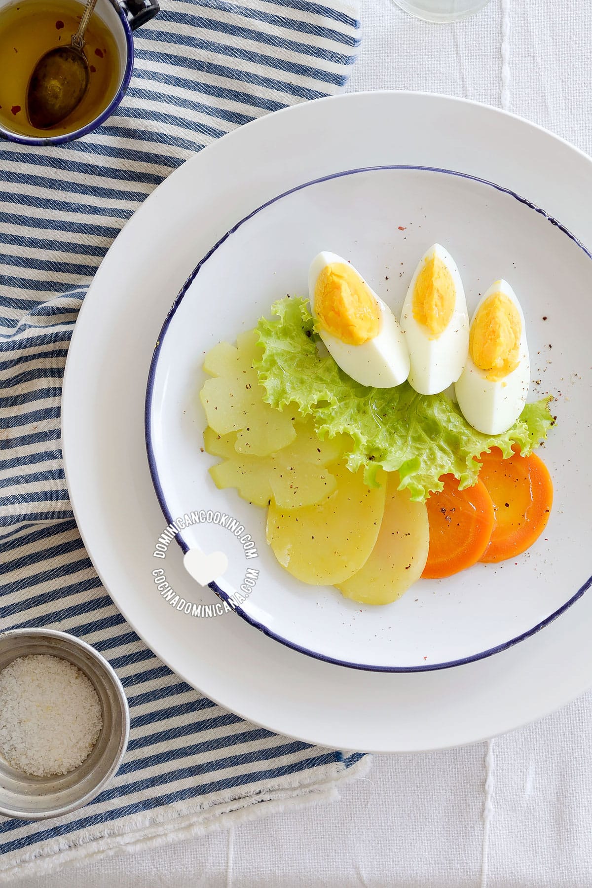 Ensalada Hervida (Boiled Salad) served alongside vinaigrette seen from above