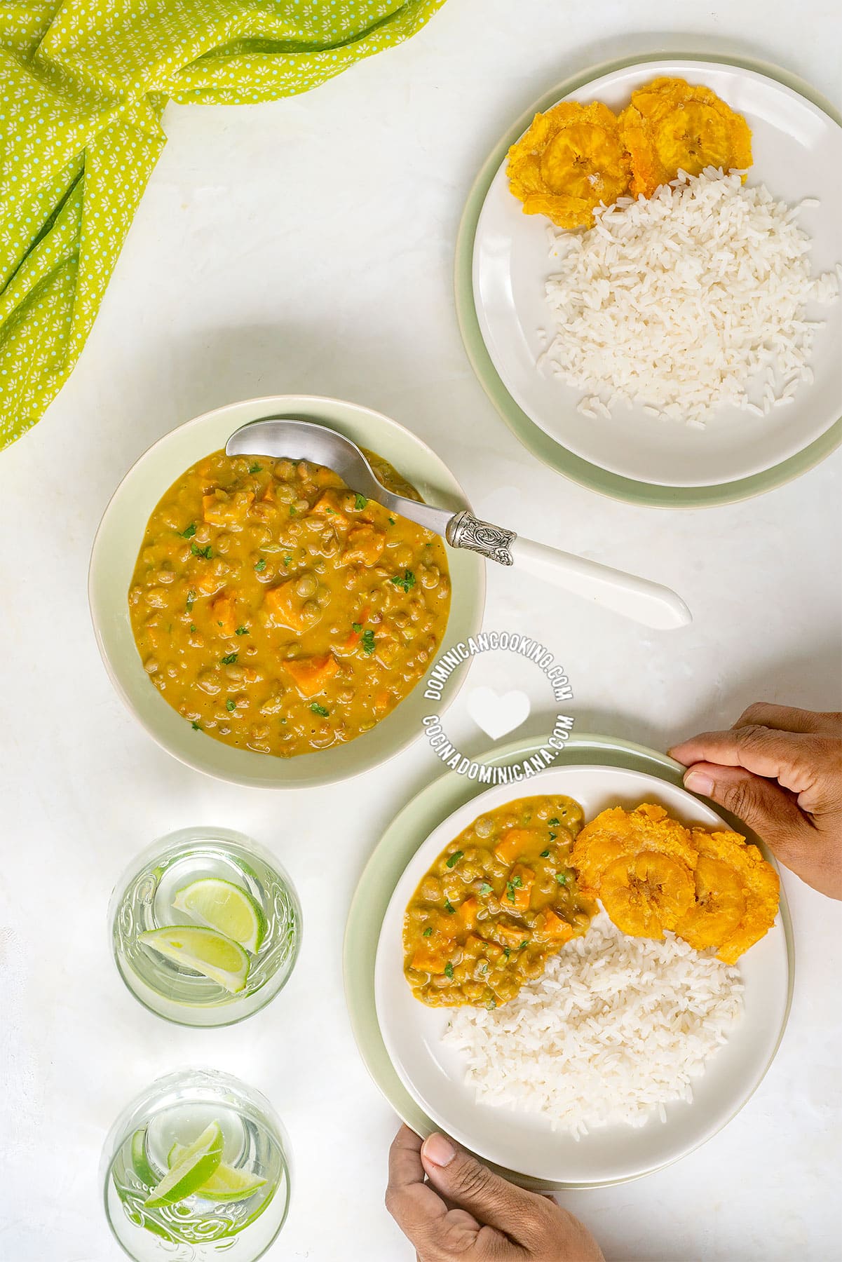 Hands holding bowl of Guandules con Coco (Pigeon Peas with Coconut)