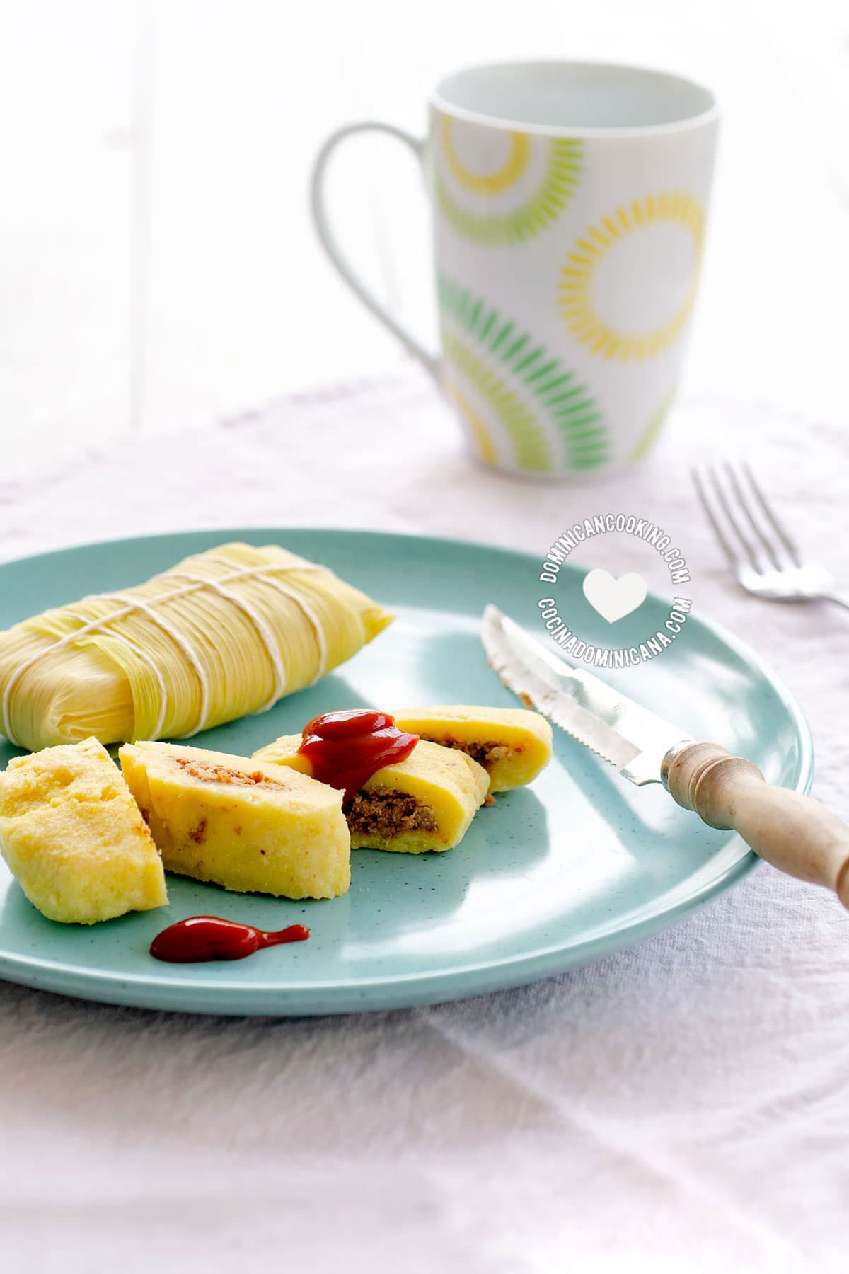 Guanimos Salados (Cornmeal and Beef Pockets) on Blue Plate