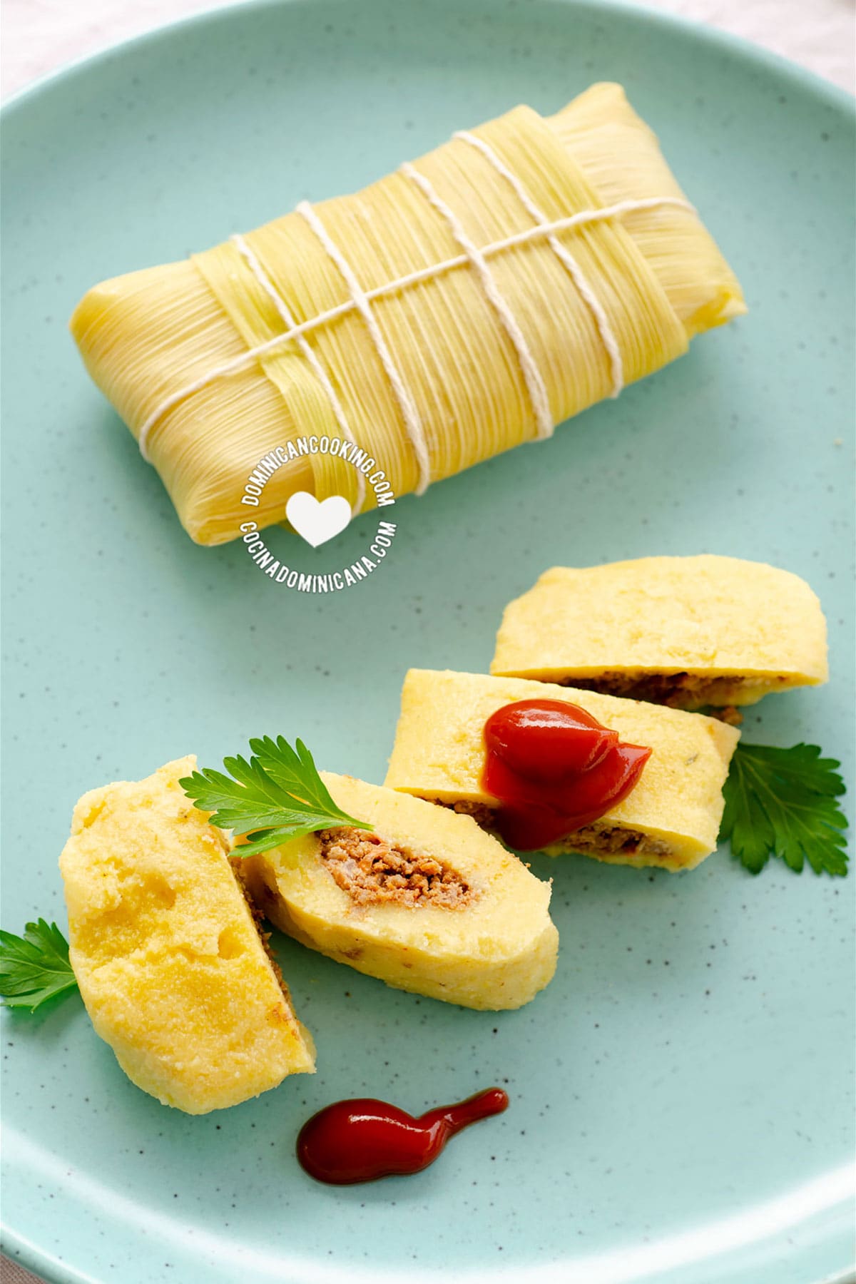 Guanimos Salados (Cornmeal and Beef Pockets) on Blue Plate