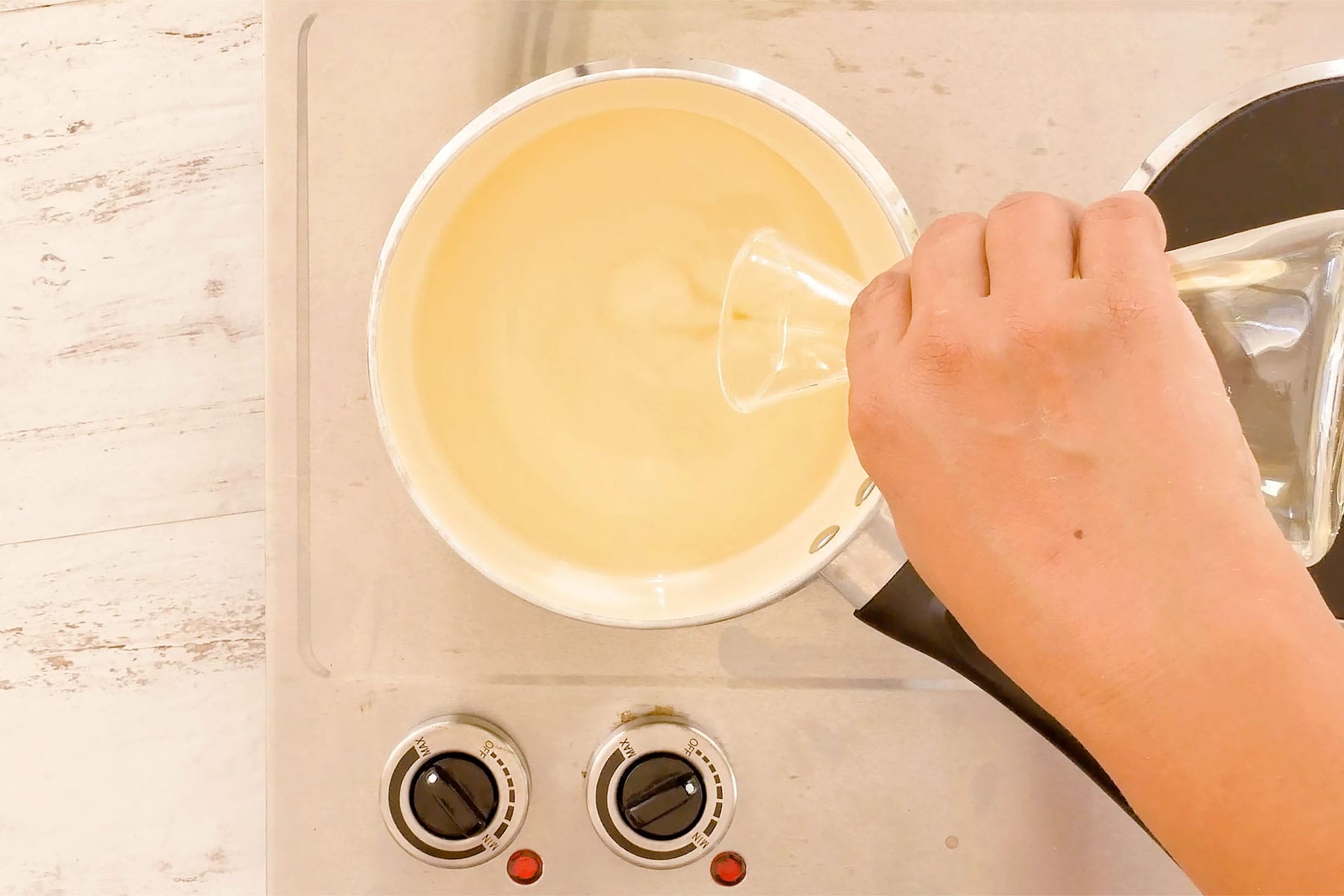 Pouring oil into pot