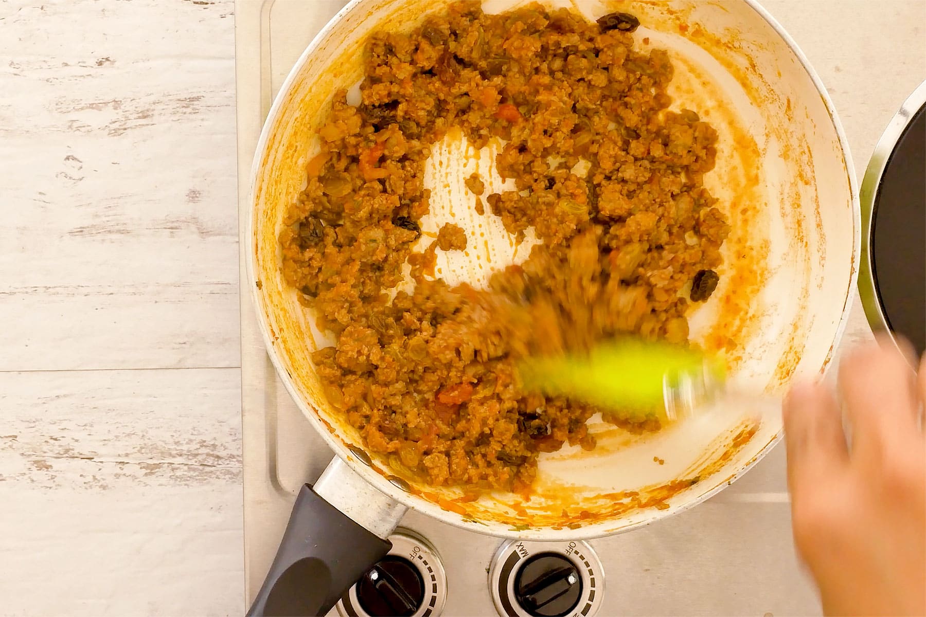 Meat simmering in the pan