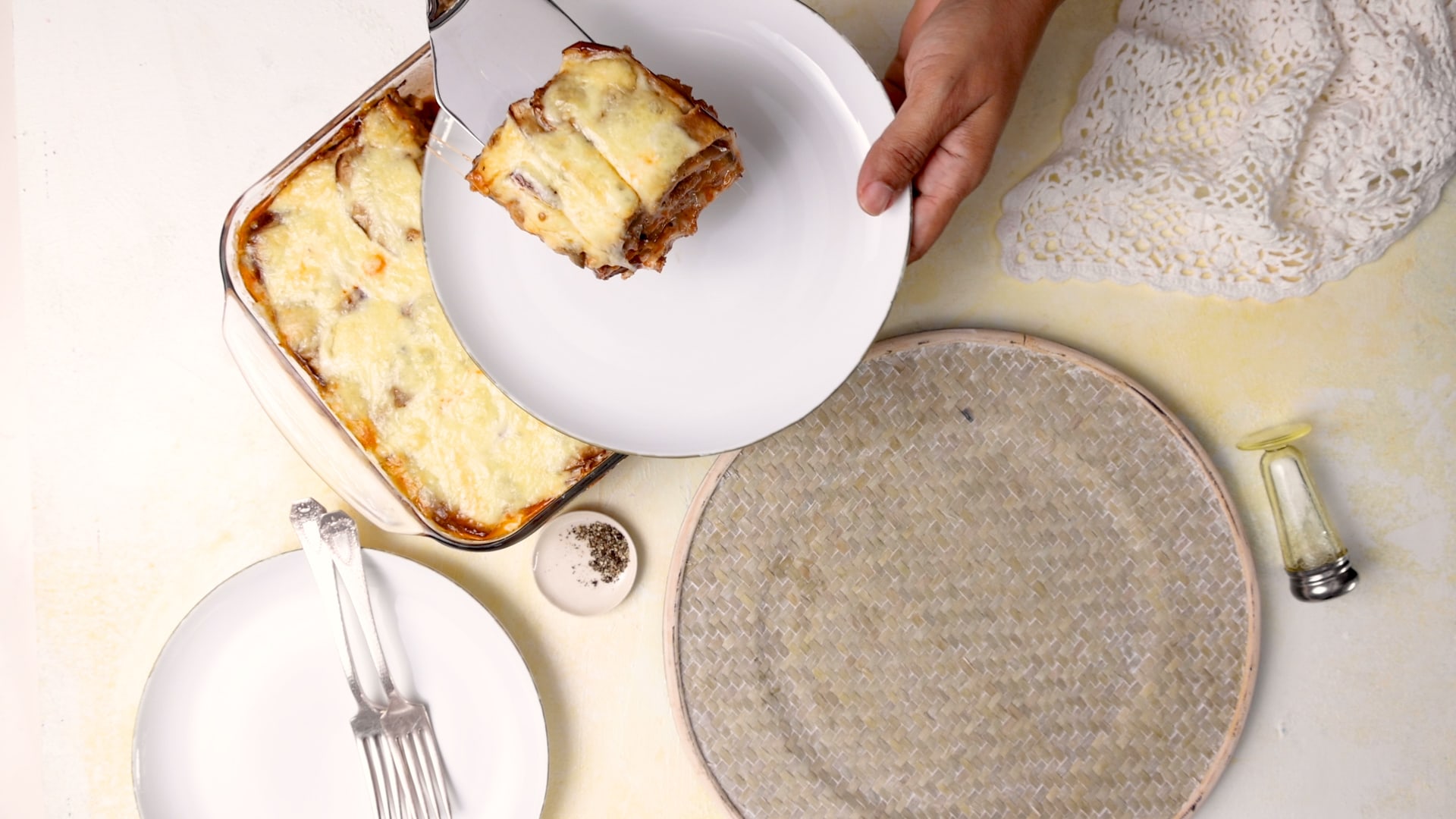 Serving a slice of eggplant casserole