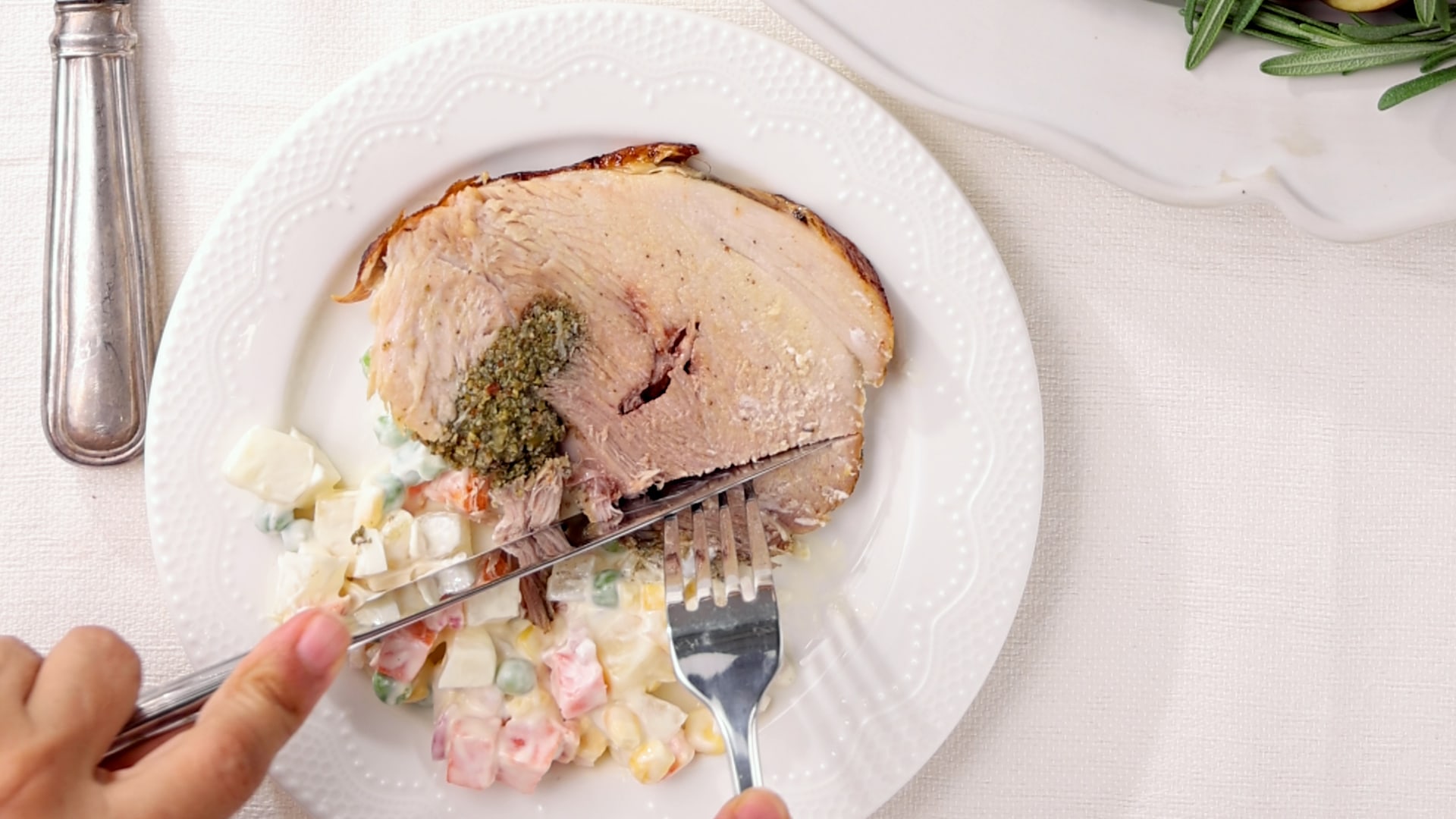 Served lechón with ensalada rusa