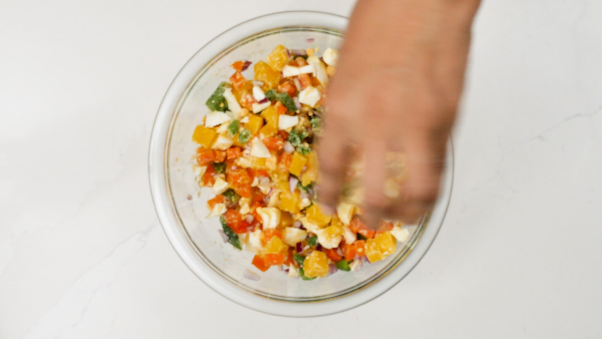 Mixing potato salad