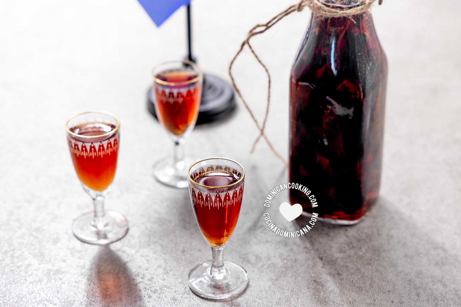 Glass shots and bottle of mamajuana spiced Dominican drink