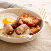 Dominican keto breakfast of fried cheese, egg and sausage with mash