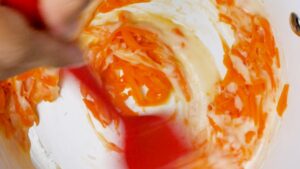 Stirring cheddar sauce