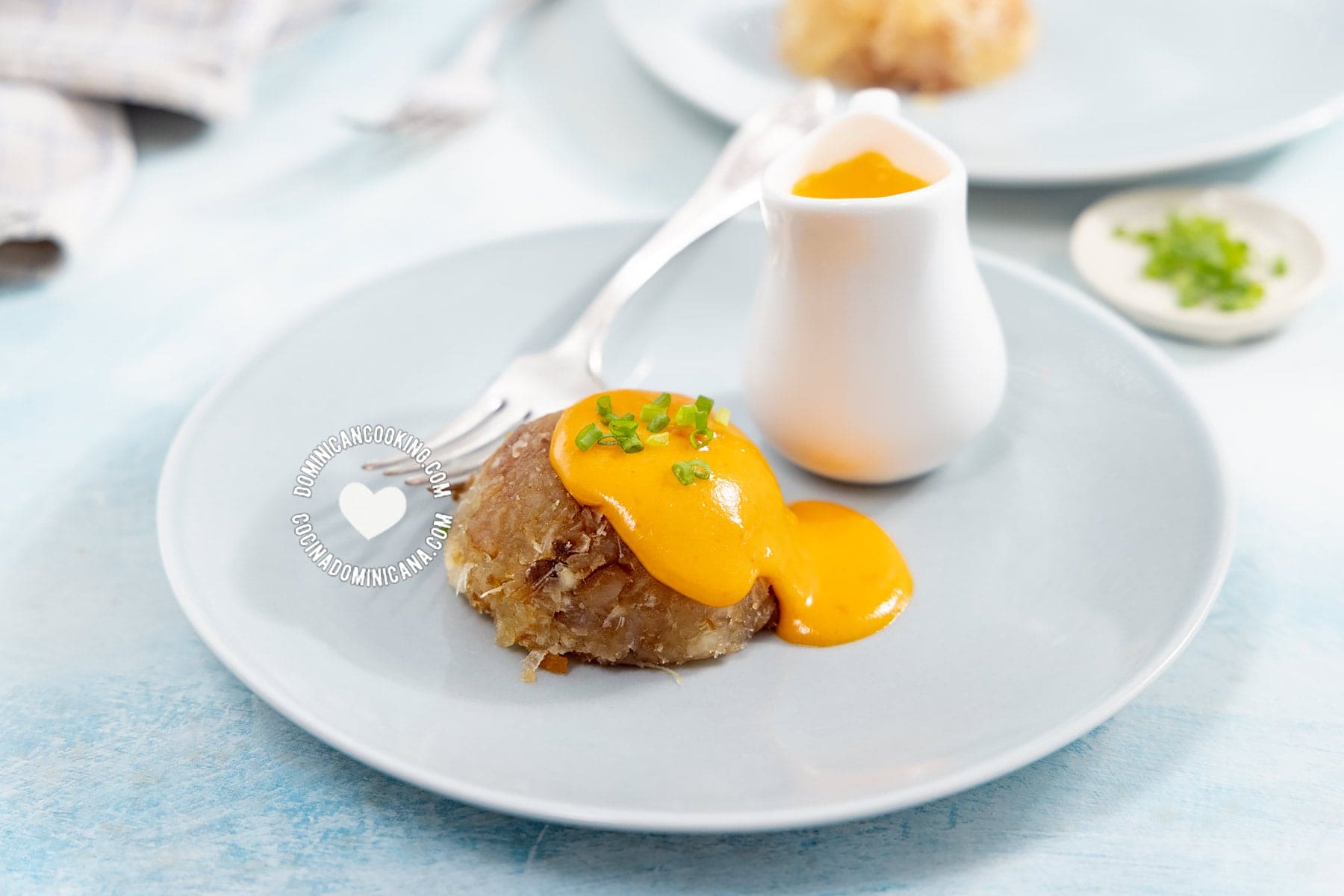 Mofongo de yuca served with cheddar sauce