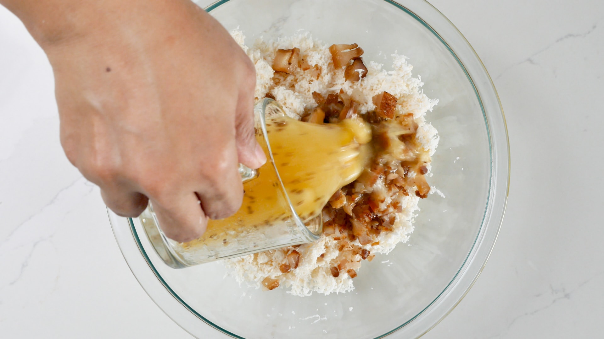 Adding broth to dough