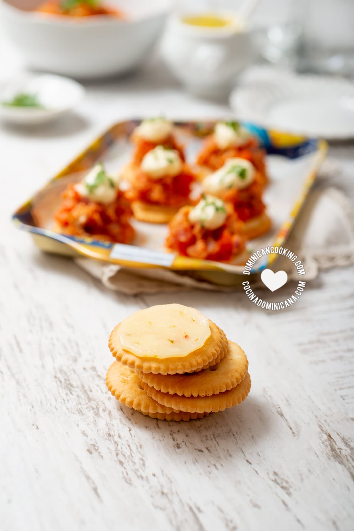 Ritz crackers topped with cheese with red pepper flakes