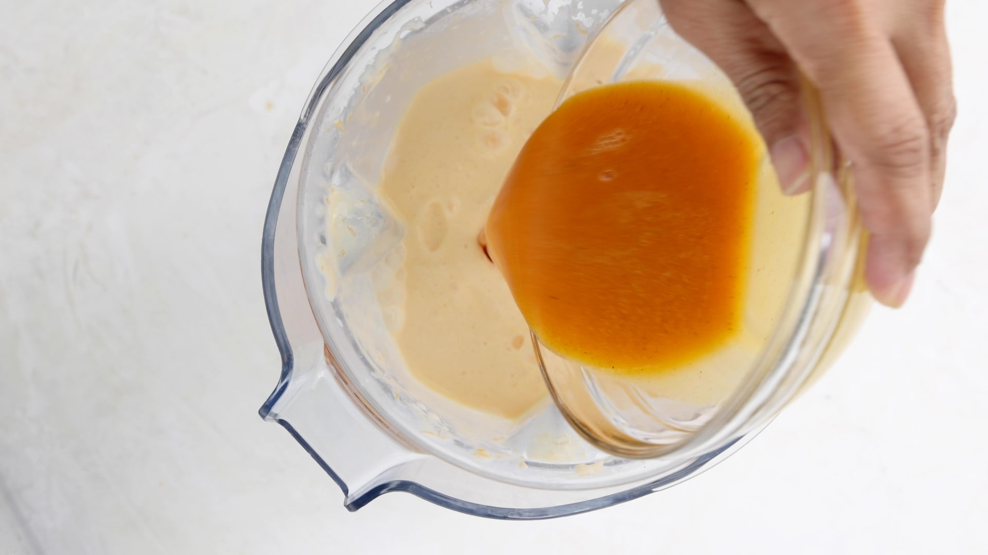 Adding passionfruit juice to smoothie