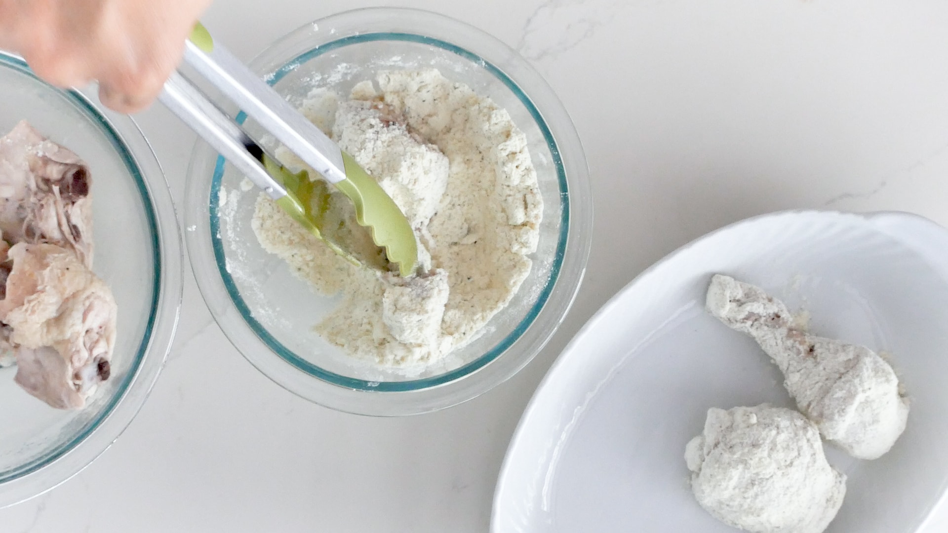 Coating chicken with flour