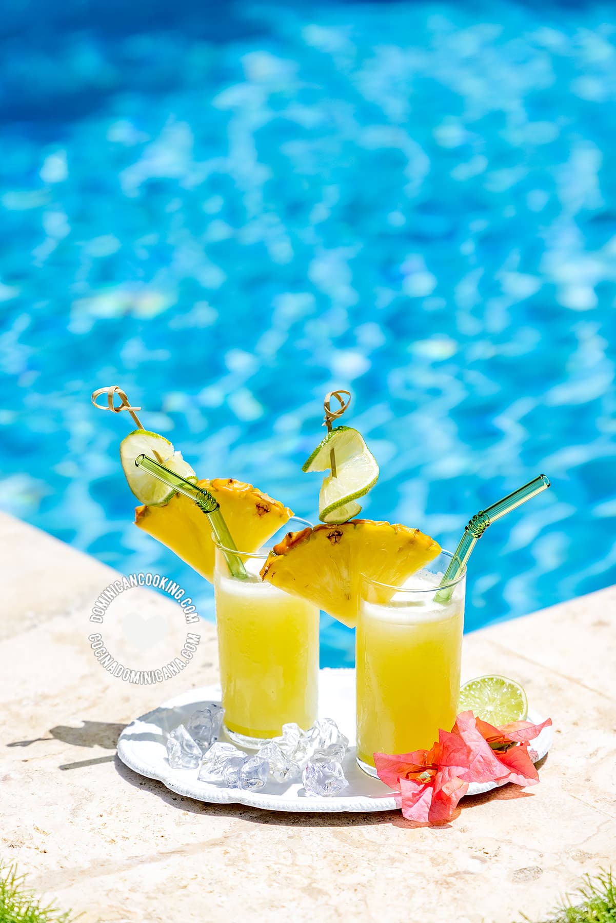 2 glasses of pineapple limeade by the pool