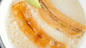Frying plantain slices