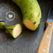 Peeling green unripe plantain