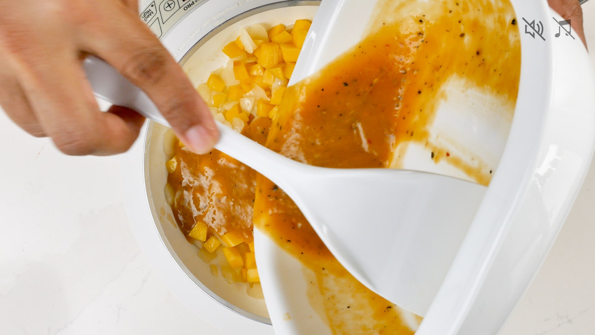 Adding the marinade to the onion and mango