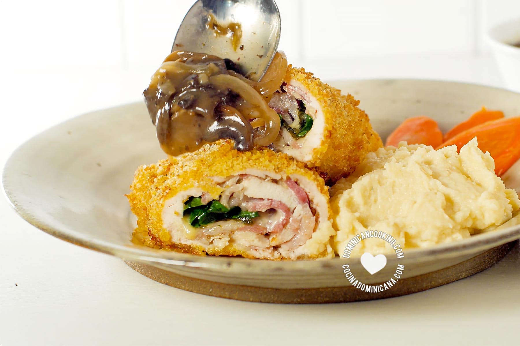 Serving mushroom sauce on cordon bleu chicken