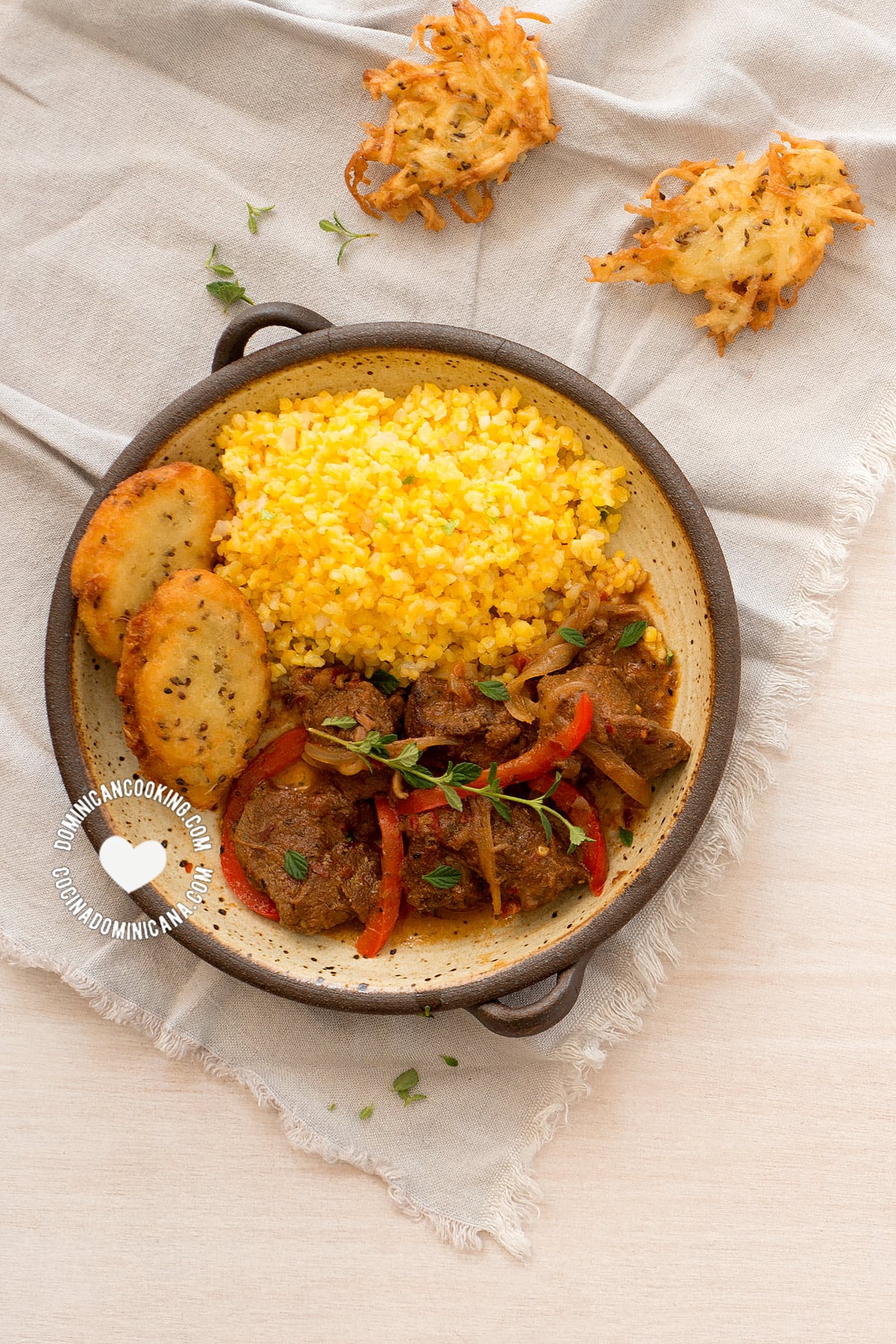 Chenchén con Chivo y Arepitas de Yuca(Cracked Corn Pilaf)