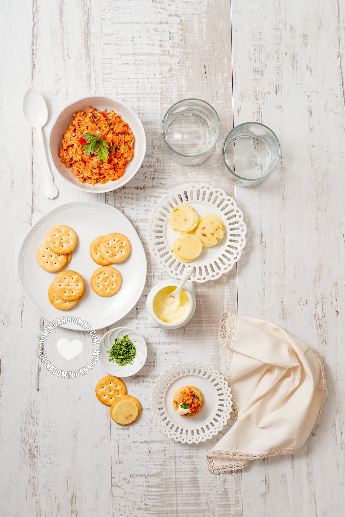 Table with spread of spicy chicken cracker toppers