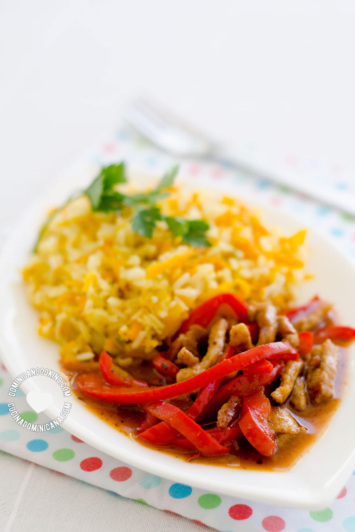 Plate of Spicy Pepper and Orange Beef with Yellow Rice