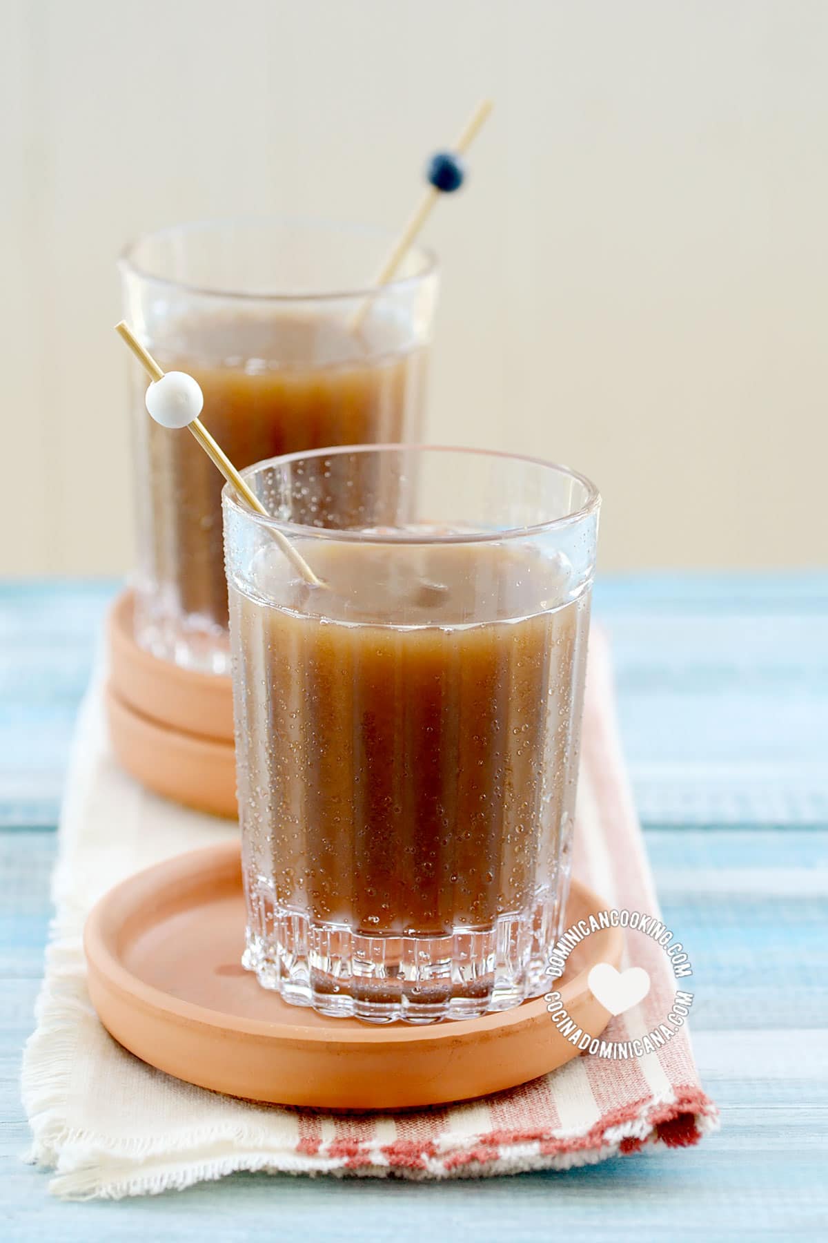 Two glasses of champola de tamarindo (tamarind juice)