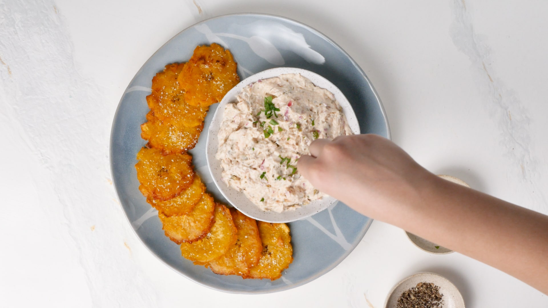 Garnishing salmon dip with parsley