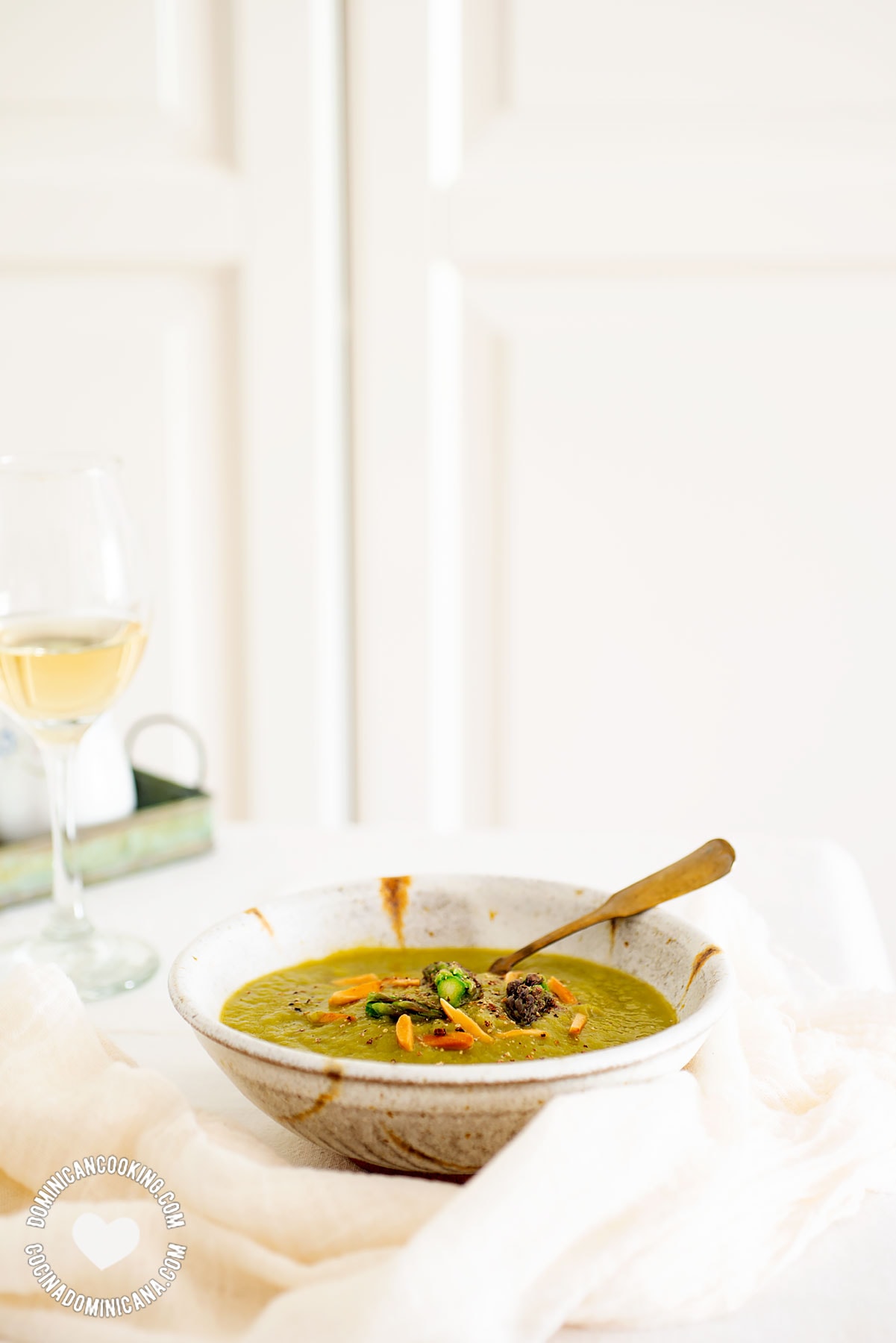 Bowl of Vegan Cream of Asparagus Soup and Glass of Wine